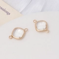 Détail macro de pendentifs en cristal facetté avec connecteurs doubles boucles dorés DIY - Blanc