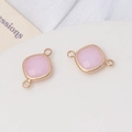 Détail de connecteurs en pierre rose à facettes avec anneaux dorés pour bijoux faits main - Faux Jade Rose