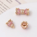 Macro detail of 14K gold-plated screw clasp and heart-shaped zircon crown connector - Crown Bud Threaded Connector / 14K Gold-Pink Zirconia