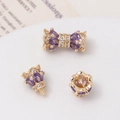Macro view of gold-plated crown clasps with purple heart zircons and intricate crystals - Crown Bud Threaded Connector / 14K Gold - Purple Zircon