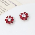 Pair of sunflower stud earrings with red crystal petals and central white cubic zirconia - Silver Tone Red