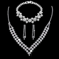Detailed view of silver-plated bridal jewelry set with sparkling rhinestone V-shaped necklace - 692+782 3-Piece Set / Silver
