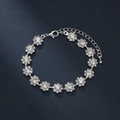 Close-up of beaded silver-tone flower bracelet with sparkling crystal accents - Single Bracelet