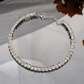 Luxurious silver bridal tennis bracelet featuring sparkling round-cut crystals and lobster clasp - Single Row Rhinestone Choker