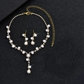 Macro shot of elegant gold pearl and rhinestone jewelry set on black background display - Gold Artificial Pearl Two-piece Set