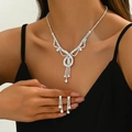Silver sunflower rhinestone necklace and fringe earring set worn by a model - G295 Silver 2-Piece Collection