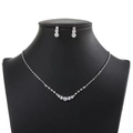 Silver necklace and earring set with round crystal rhinestones on a black neck model - A01