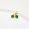 Detailed close-up of a gold cherry pendant with vibrant green and white cubic zirconia stones - Style 1 / Green Cherry