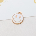 Macro shot of gold-plated smiley face pendant with white enamel for DIY jewelry - 01# White
