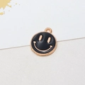 Macro detail of a black enamel smiley face pendant with gold plating for DIY jewelry - 01# Black