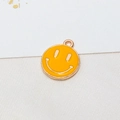 Macro detail of a bright yellow smiley face pendant with gold plating for DIY jewelry - Yellow (Style 01)