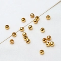 Macro view of polished 18K gold plated round copper spacer beads for jewelry making - Polished Ball / 3mm (ai-100 Pieces/Pack)