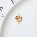 Macro shot of gold plated spiral flower pendant with micro-set zircons and dual loops - Spiral Circle Style (03#)