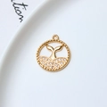 Macro detail of a gold-plated dolphin tail pendant with sparkling zircon inlays - Whale Tail Disc Style (03#)