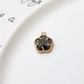 Detailed close-up of 12mm flower pendant with gold-plated frame and dark faceted stone - Dark Gray