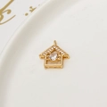 Macro detail of a gold house-shaped pendant with cubic zirconia for DIY jewelry making - Gold Little House Shape (LF2389)