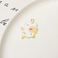 Close-up of a cute white enamel cartoon sheep charm for DIY jewelry and bracelets - Little Sheep