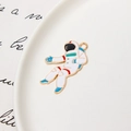 Macro view of gold astronaut enamel charm for DIY jewelry and necklace making - Astronaut 01 / Minimum 10 Pcs