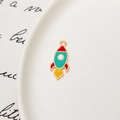 Macro detail of colorful enamel rocket pendant with gold trim for DIY jewelry making - Rocket 06
