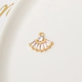 Close-up of a fan-shaped gold pendant with cubic zirconia for DIY jewelry making - White Fan Shaped Pendant