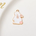 Macro view of white enamel rabbit charm with gold trim and pink details for DIY jewelry - Pink Ear Sitting Rabbit (05#)