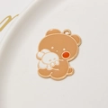 Detailed macro view of a cartoon brown bear and white bunny enamel pendant with gold edges - Bear With Rabbit Style (01#)