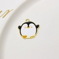 Detail showing a cute cartoon penguin alloy charm with colorful oil drip and golden plating - Cartoon Penguin Style (04#)