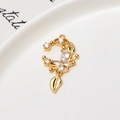 Macro shot of gold pendant with butterfly floral design and cubic zirconia stones - Butterfly Moon Floral Style (01#)