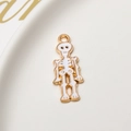 Close-up of white enamel skull pendant with gold plating for Halloween DIY jewelry - Skeleton Figure (06#)