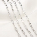Macro view of bright silver paperclip chain links on a white textured background - 3*9mm / White Gold