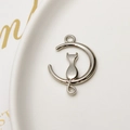 Macro view of silver moon and cat metal pendant connector for DIY jewelry making - Silver Cat Style