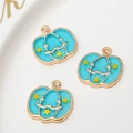 Three light blue Halloween pumpkin charms with yellow stars and golden alloy trim - Blue Pumpkin