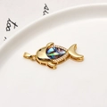 Detailed view of a gold fish pendant featuring iridescent abalone shell and zircon stones - Whale Abalone Shell Style