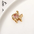 Macro detail of tropical fish pendant in gold with pink stone and zircon inlay - Pink Zirconia Fish Style