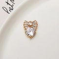 Pendentif nœud doré avec zircons blancs et une grande pierre ronde brillante - Pendentif Diamant Rond Nœud (LF2507)