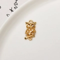 Golden owl pendant with micro-pave white cubic zirconia on a white ceramic tray - Minimum 10 Pieces Price / Owl Shape (04)