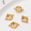 Detailopname van vier gouden klauwzettingen voor DIY sieraden maken en creatieve projecten - 8mm Diameter Dubbele Lus