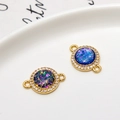 Gold plated circular link pendant with star-like opal stone and cubic zirconia inlay - Dark Blue