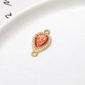 Pear-shaped gold plated copper connector with red faux opal and white zircons - Red