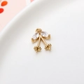 Golden cherry pearl pendant base with hollow design and sparkling cubic zirconia stones - 06#10*15mm