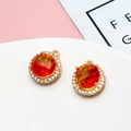 Round golden pendant with central orange zircon and white rhinestones for DIY jewelry - Orange-Red Gradient