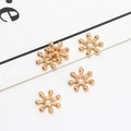 Macro shot of gold sunburst flower spacer beads for DIY jewelry and bracelet making - 04# 7mm (Inner Diameter 1mm)