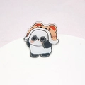 Cute panda acrylic brooch wearing a red bear hat on a soft pink background - 45mm / Tiger Hat Panda