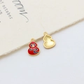 Detail of enamel gourd pendant with Fu character and matte gold finish on fabric background - Style 02#