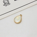 Detail view of teardrop gold plated copper pendant with white faux opal glitter for DIY jewelry - White