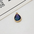 Close-up of teardrop gold-plated pendant with glitter resin for DIY jewelry making - Dark Blue