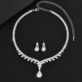 Elegant silver bridal jewelry set with sparkling crystals and pear-shaped pearl necklace - Necklace And Earrings Style (864)
