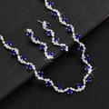 Macro detail of silver plated necklace and earrings set with deep blue crystals on leather - Blue (Necklace Earrings Set)