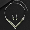Close-up of V-shaped bridal necklace and earrings with green gems and white rhinestones - Green Gem Silver Single Set(DTN14027052AP)