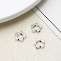 Three antique silver flower-shaped spacer beads for DIY jewelry making on white fabric - Five-Petal Flower Spacer (17#10mm)